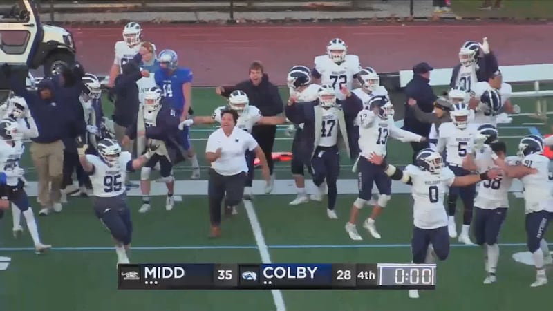 Middlebury celebrates a NESCAC title following its win over Colby