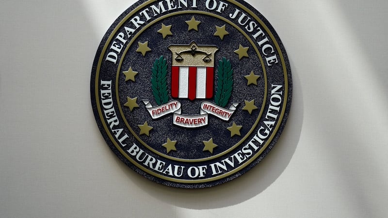 FILE - An FBI seal is seen on a wall on Aug. 10, 2022, in Omaha, Neb. The FBI estimates...