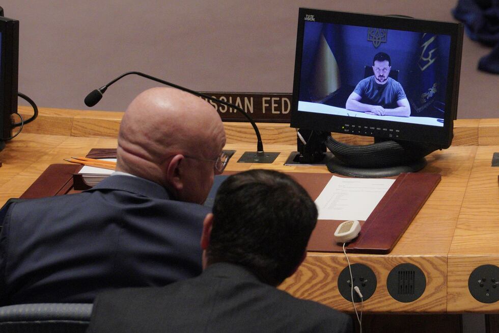Russia's United Nations Ambassador Vasily Nebenzya, left, confers with an aide, while Ukraine...