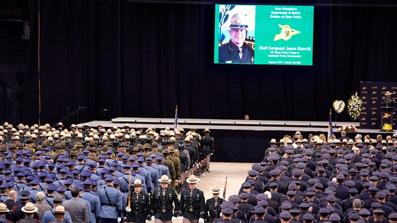 A likeness of New Hampshire State Police Staff Sgt. Jesse Sherrill appears on a screen, top,...